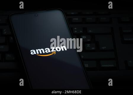 Ljubljana, Slovenia - 21 January 2023: Amazon logo on smartphone screen laying on computer keyboard Stock Photo