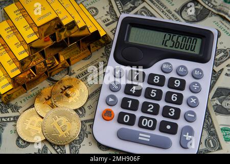 Gold bars with calculator on dollar bills background and bitcoin digital cryptocurrency coin. Bank image and photo background. Money saving investment Stock Photo