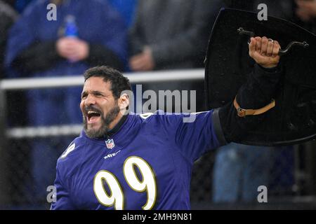 Defensive lineman Gary Burley of the Cincinnati Bengals waves to