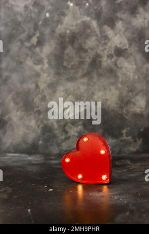 Red lighted heart on a black bacground. Copy space Stock Photo