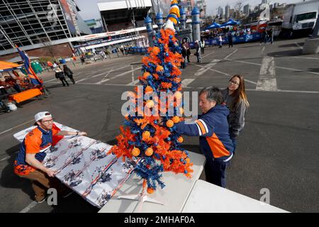 A Denver Broncos Christmas tree is set up as fans tailgate prior