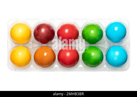 Colorful Easter eggs, colored Paschal eggs, in a clear plastic egg box. Hard boiled, dyed chicken eggs, used to celebrate the resurrection of Jesus. Stock Photo