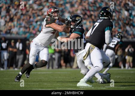 Tampa Bay Buccaneers linebacker Carl Nassib (94) works against Jacksonville  Jaguars tight end Nick O'Leary (86) while pressuring quarterback Nick Foles  (7) during the first half of an NFL football game Sunday