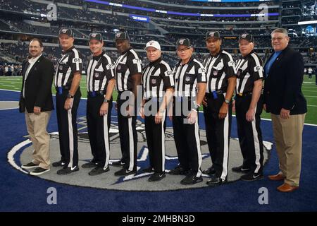 NFL game officlals, from left, replay official Brian Matoren, down judge  Tom Stephan (68), field judge Lee Dyer (27), umpire Ruben Fowler (71),  referee Walt Anderson (66), side judge Rick Patterson (15)