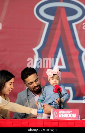 Anthony Rendon looks over with his daughter, Emma, during a news conference  to introduce Rendon as the newest Los Angeles Angels baseball player in  Anaheim, Calif., Saturday, Dec. 14, 2019. Rendon and