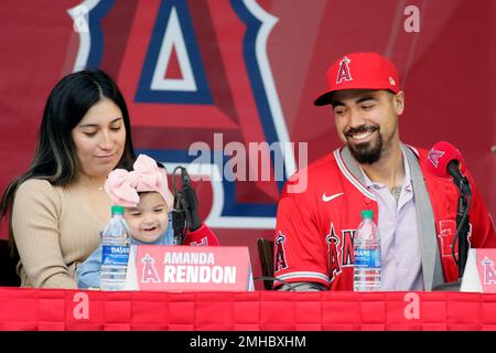 Anthony Rendon looks over with his daughter, Emma, during a news conference  to introduce Rendon as the newest Los Angeles Angels baseball player in  Anaheim, Calif., Saturday, Dec. 14, 2019. Rendon and
