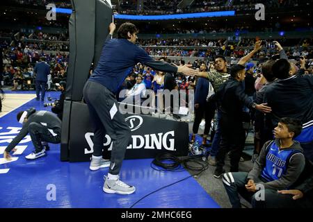 Dallas Mavericks' Boban Marjanovic shakes hands with a fan prior