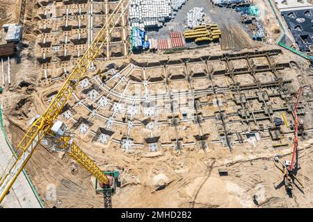 pouring foundation with concrete for further construction. ground work. aerial top view. Stock Photo