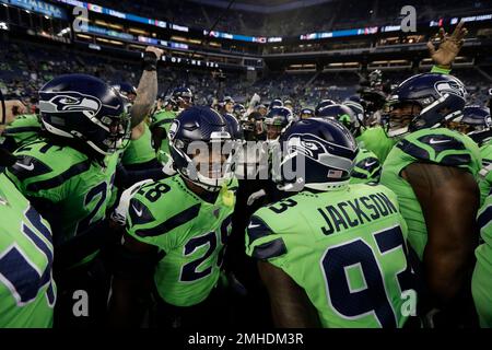 Minnesota Vikings defensive players huddle on the field during the