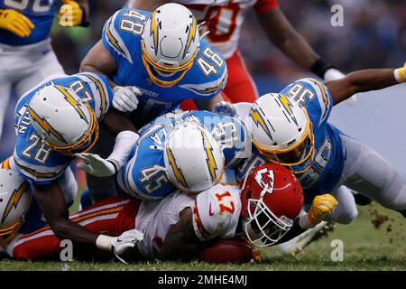 Los Angeles Rams cornerback Cobie Durant (14) leaps over a pile of players  during a preseason NFL football game against the Cincinnati Bengals  Saturday, Aug. 27, 2022, in Cincinnati. (AP Photo/Jeff Dean