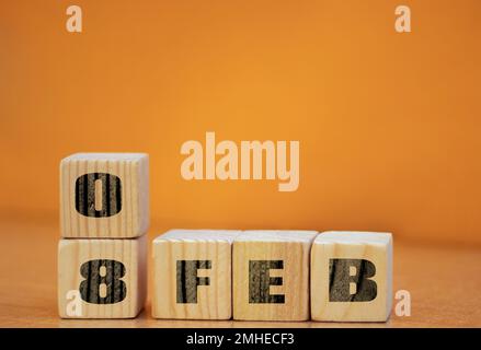 Cube shape calendar for February 08 on wooden surface with empty space for text, new year Wooden calendar with date, January cube calendar on wooden s Stock Photo