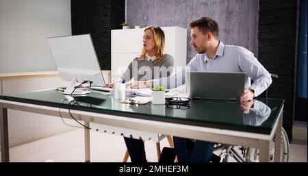 Two Analyst People Working On Computer In Office Stock Photo