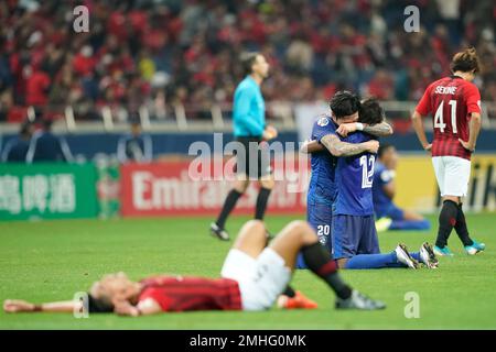 Al Hilal's Ali Al Bulayhi, right, fights for the ball with Urawa