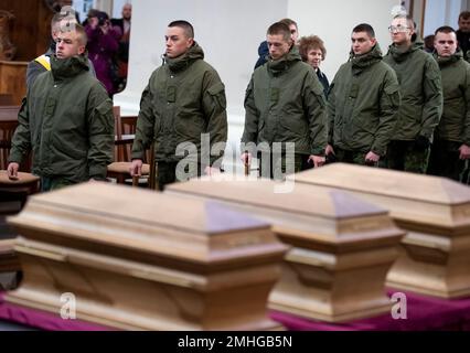 The Lithuania's soldiers pay their respects at the caskets of commanders Zygmunt Sierakowski and Konstanty Kalinowski and 18 other participants of the 1863-1864 uprising is carried through Cathedral Basilica of St. Stanislaus and St. Ladislaus during the state funeral ceremony in Vilnius, Lithuania, Friday, Nov. 22, 2019. Unearthed mass burials of the participants of the 1863 uprising discovered almost three years ago on the Gediminas Hill in Vilnius. Rebels fight against Russian empire's tsar regime at that time Lithuania was part of that empire. An uprising that broke out on 22 January 1863 