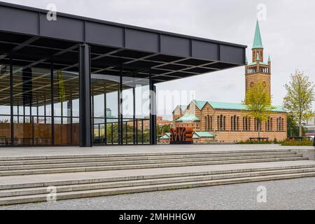 The New National Gallery designed by Ludwig Mies van der Rohe and St. Matthew's Church, both part of the Kulturforum Berlin. Stock Photo