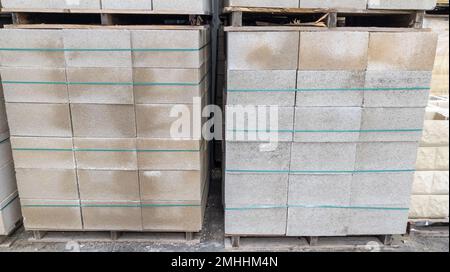 cinder block pallets grey cement construction material wearhouse ready for sale Stock Photo