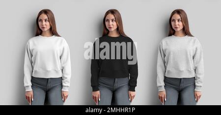 Mockup of white, black, heather crop sweatshirt on a beautiful girl, women's shirt for design, pattern, print, front view. Template of fashion casual Stock Photo