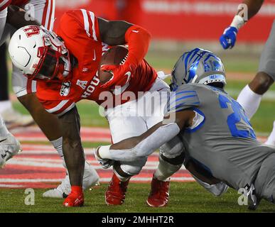 Houston running back Chandler Smith left is attacked by Memphis