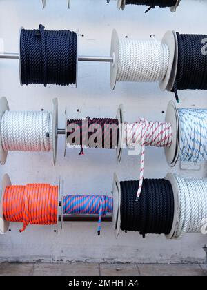 Rope on round bobbins of different colors shop ropes on outdoor store ...