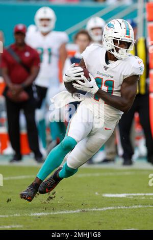 New England Patriots wide receiver DeVante Parker (1) catches the ball as  he practices on the field before an NFL football game against the Miami  Dolphins Sunday, Sept. 11, 2022, in Miami