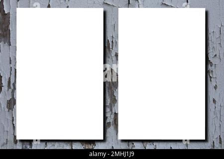 two white empty blank Vertical Posters Mockup A4 Mock-up on vintage old grey wooden wall Stock Photo