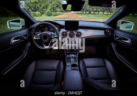 Inside moden car background, luxury car interior elements wallpaper. Black leather car interior Stock Photo