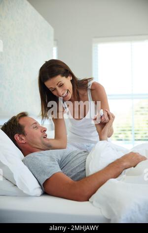 You better prepare for fatherhood. a mature couple feeling excited after taking a home pregnancy test. Stock Photo