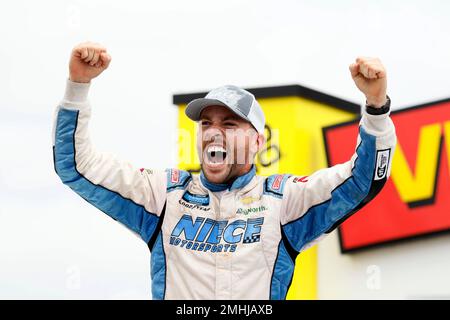 FILE - In this June 16, 2019, file photo, Ross Chastain celebrates in Victory Lane after winning a NASCAR Truck Series auto race at Iowa Speedway in Newton, Iowa. The NASCAR Truck Series has its championship race Friday, Nov. 15, 2019, at Homestead-Miami Speedway. Brett Moffitt, Matt Crafton and Stewart Friesen join Ross Chastain in the championship field. Moffitt is the defending series champion and will try to become the first repeat winner since Crafton in 2013 and 2014. (AP Photo/Charlie Neibergall, File)