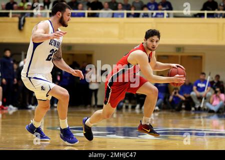 Stony Brook guard Jordan Mckenzie 10 drives to the basket past Seton Hall forward Sandro Mamukelashvili 23 during the first half of an NCAA college basketball game Saturday Nov. 9 2019 in