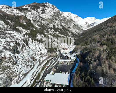 Winter aerial view of Frejus motorway tunnel under the Alps on the border between France and Italy.  Bardonecchia, Italy - January 2023 Stock Photo