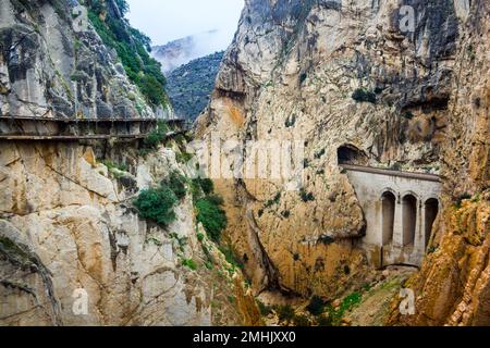 Deep canyon next to mountain path El Caminito del Rey in El Chorro Spain Stock Photo