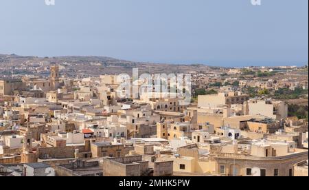 Summer landscape of Gozo island, residential district with a lot of hsmall houses, Malta Stock Photo