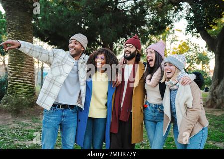 A group of young friends in a holiday or vacation trip having fun together. Multiracial happy people smiling enjoying a outumn weekend day. Lifestyle concept. High quality photo Stock Photo