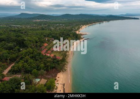 Aerial view of dark rocks in the turquoise Mediterranean Sea with white ...