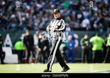 NFL official, back judge Scott Helverson (93) wearing a crucial