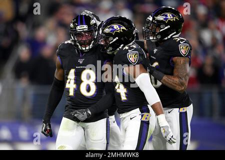 Baltimore Ravens safety Chuck Clark (36) and cornerback Marlon