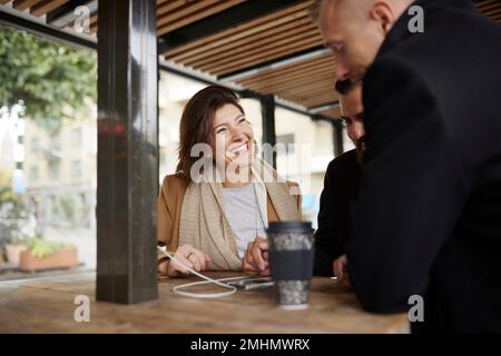 Smiling business people talking together Stock Photo