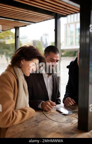 Smiling business people talking together Stock Photo