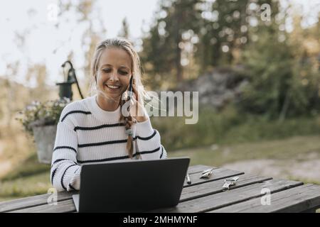 Young woman taking via cell phone Stock Photo