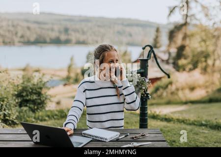 Young woman taking via cell phone Stock Photo