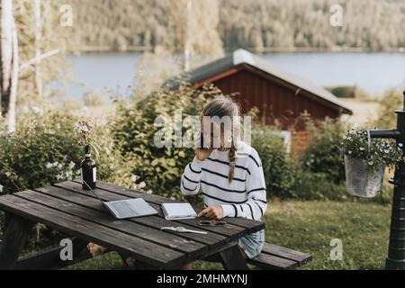 Young woman taking via cell phone Stock Photo