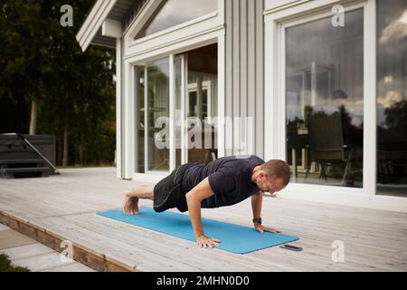 Man doing push-ups Stock Photo