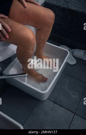 Woman having footbath Stock Photo