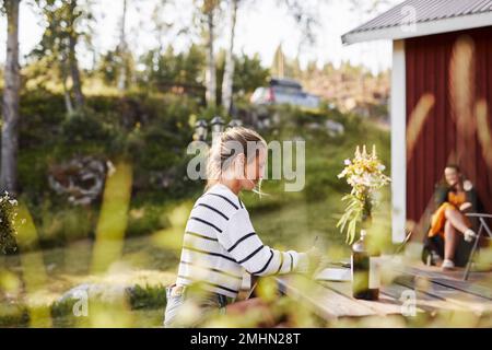 Smiling woman taking notes Stock Photo
