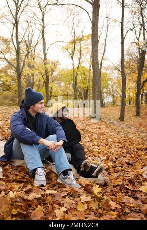 Young couple sitting together Stock Photo