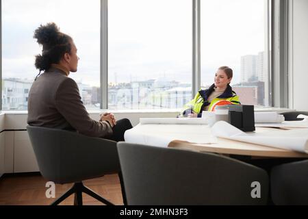 Smiling people having meeting in office Stock Photo