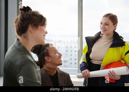 Smiling people having meeting in office Stock Photo
