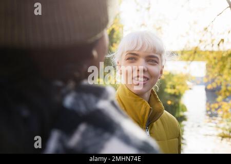 Smiling woman looking away Stock Photo