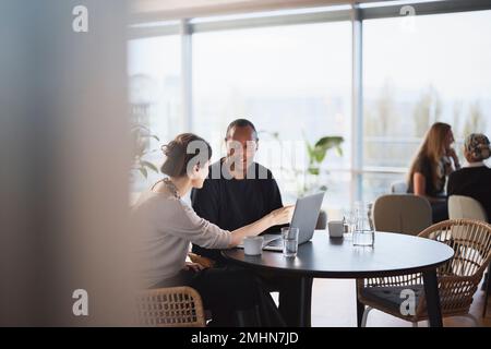 People talking in cafeteria Stock Photo