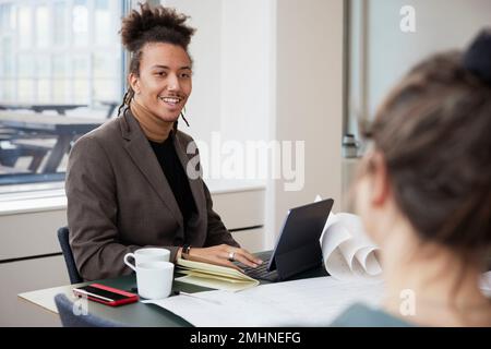 Smiling man in office Stock Photo